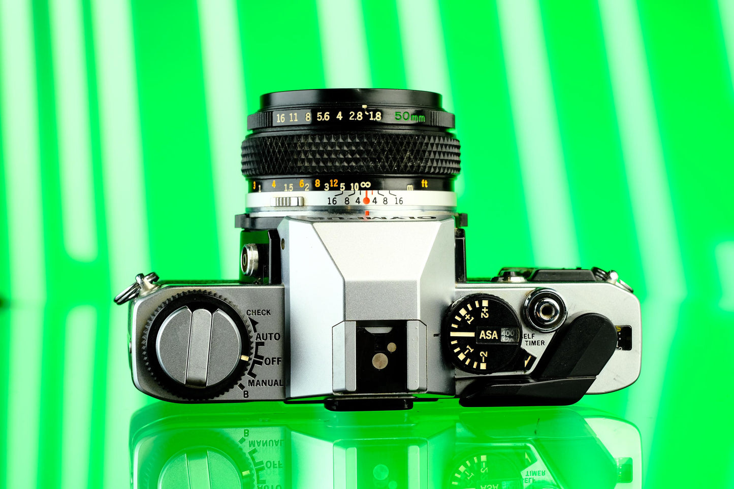 Olympus OMG 35mm SLR + 50mm f/1.8 Lens