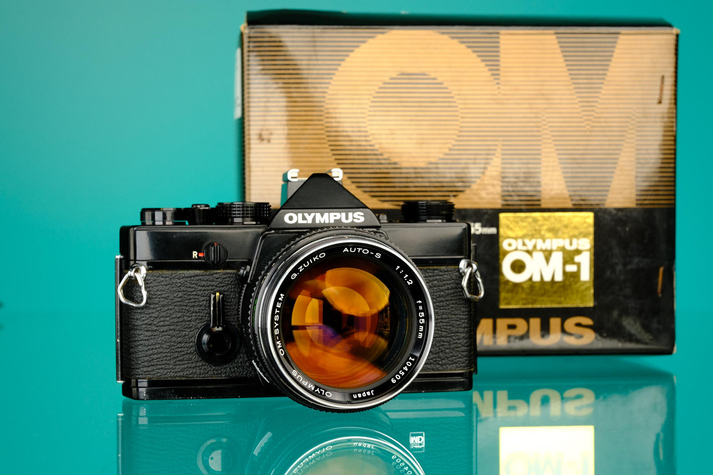 Olympus OM-1 Black 35mm SLR + 55mm f/1.2 Lens