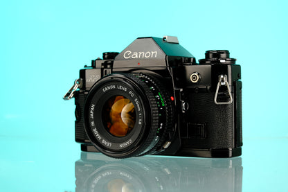 Canon A-1 35mm SLR Film Camera + 50mm f/1.8 nFD Lens