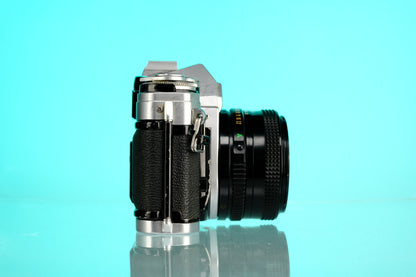 Canon AE-1 35mm SLR Film Camera + 50mm f/1.8 nFD Lens