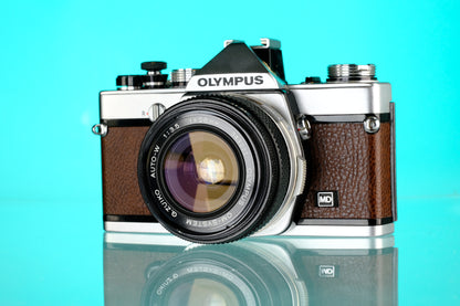 Olympus OM-1 35mm SLR + 28mm f/3.5 Auto W Wide Angle Lens