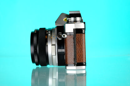 Olympus OM-1 35mm SLR + 28mm f/3.5 Auto W Wide Angle Lens