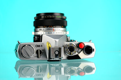 Olympus OM-1 35mm SLR + 28mm f/3.5 Auto W Wide Angle Lens