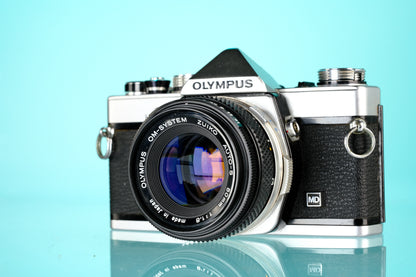 Olympus OM-1 35mm SLR Film Camera + 50mm f/1.8 Lens