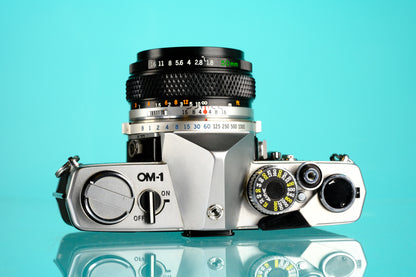 Olympus OM-1 35mm SLR Film Camera + 50mm f/1.8 Lens