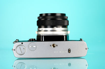 Olympus OM-1 35mm SLR Film Camera + 50mm f/1.8 Lens