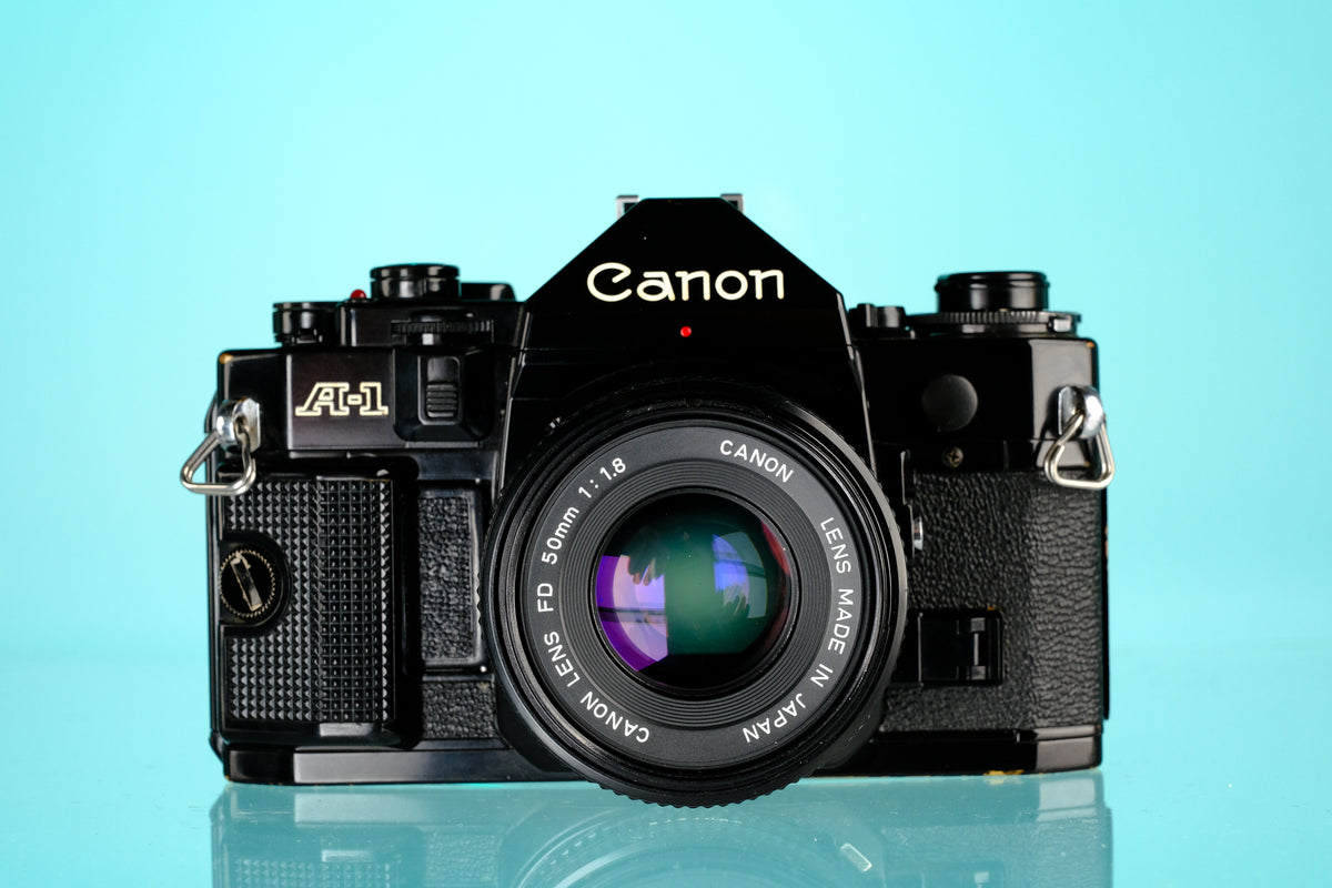 Canon A-1 35mm SLR Film Camera + 50mm f/1.8 nFD Lens