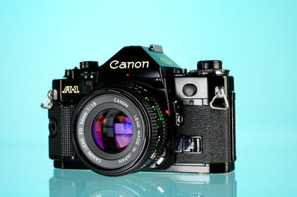 Canon A-1 35mm SLR Film Camera + 50mm f/1.8 nFD Lens