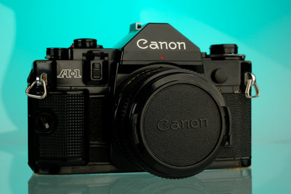 Canon A-1 35mm SLR Film Camera + 50mm f/1.8 Refurbished Lens