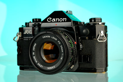 Canon A-1 35mm SLR Film Camera + 50mm f/1.8 Refurbished Lens
