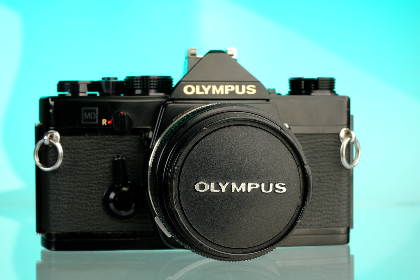 Olympus OM-1 35mm SLR Film Camera (Black) + 50mm f/1.4 Black Nose Lens