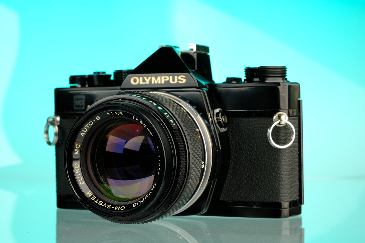 Olympus OM-1 35mm SLR Film Camera (Black) + 50mm f/1.4 Black Nose Lens
