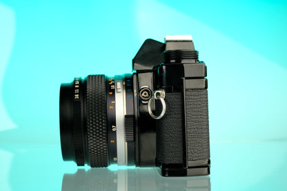 Olympus OM-1 35mm SLR Film Camera (Black) + 50mm f/1.4 Black Nose Lens