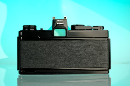 Olympus OM-1 35mm SLR Film Camera (Black) + 50mm f/1.4 Black Nose Lens