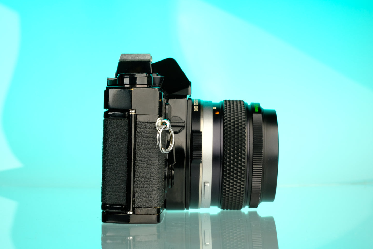 Olympus OM-1 35mm SLR Film Camera (Black) + 50mm f/1.4 Black Nose Lens