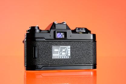 Nikon EM 35mm SLR + 60-200mm F/4-5.6