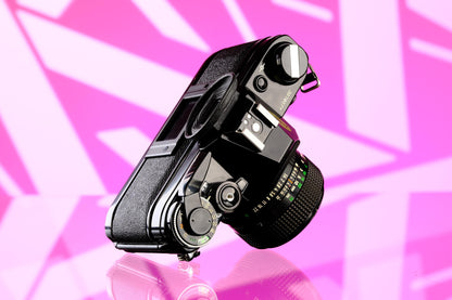 Canon Ae-1 Black 35mm SLR + 50mm f/1.4 nFD Lens