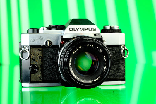 Olympus OMG 35mm SLR + 50mm f/1.8 Lens