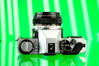 Olympus OMG 35mm SLR + 50mm f/1.8 Lens
