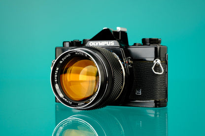 Olympus OM-1 Black 35mm SLR + 55mm f/1.2 Lens