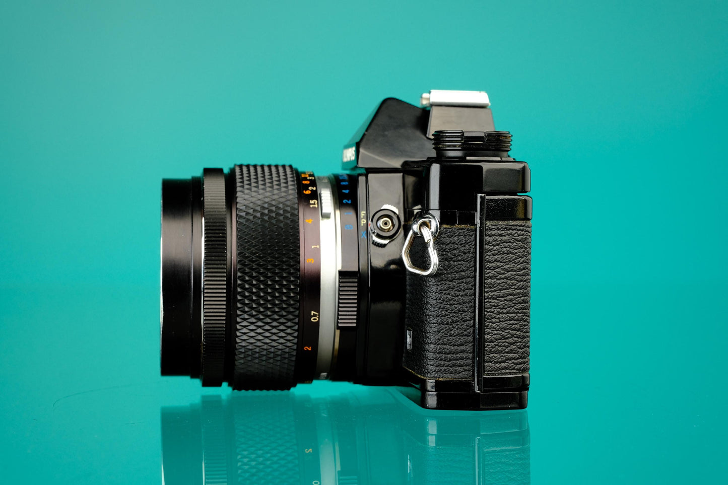 Olympus OM-1 Black 35mm SLR + 55mm f/1.2 Lens