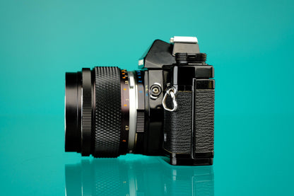 Olympus OM-1 Black 35mm SLR + 55mm f/1.2 Lens