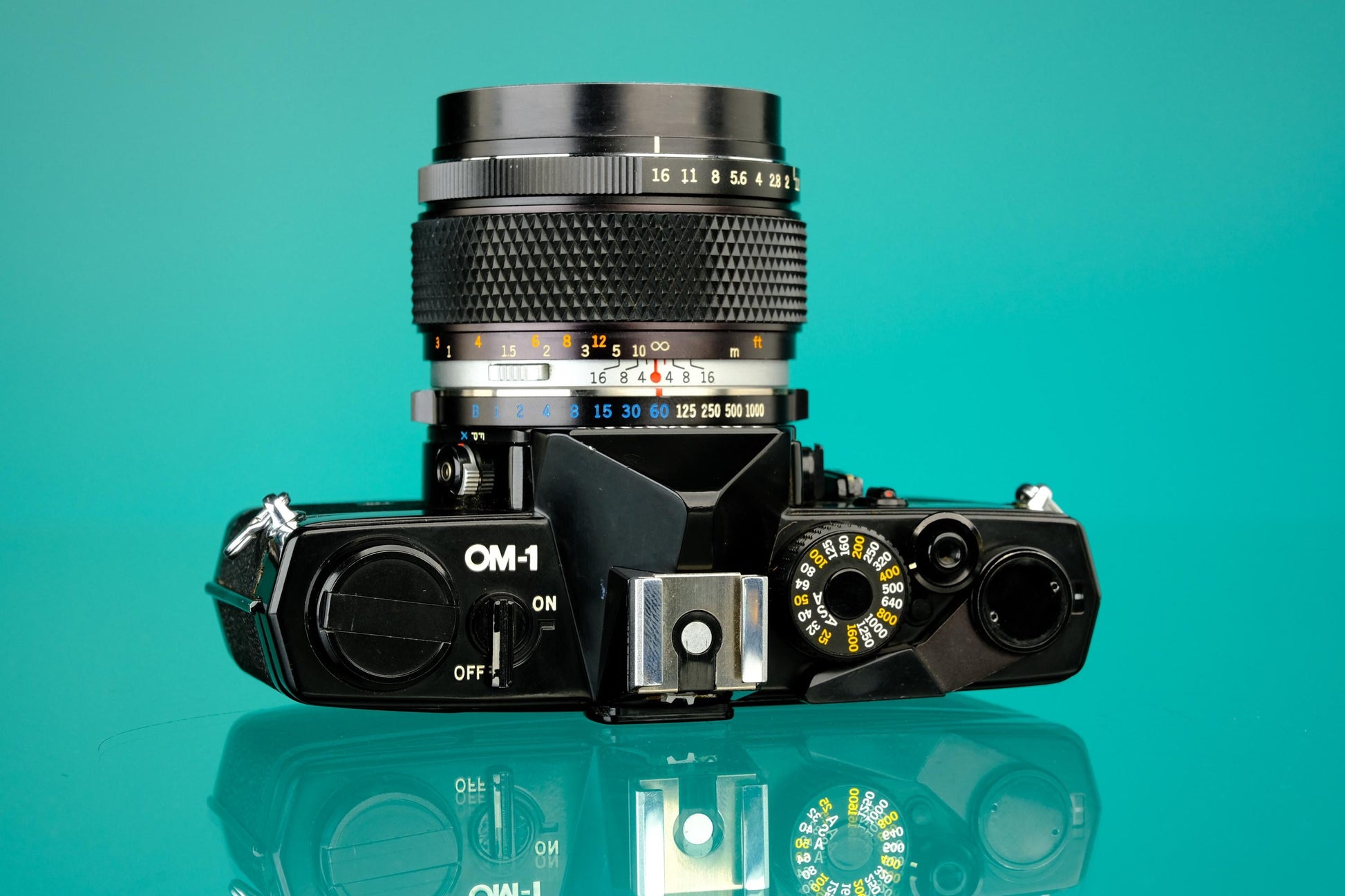 Olympus OM-1 Black 35mm SLR + 55mm f/1.2 Lens