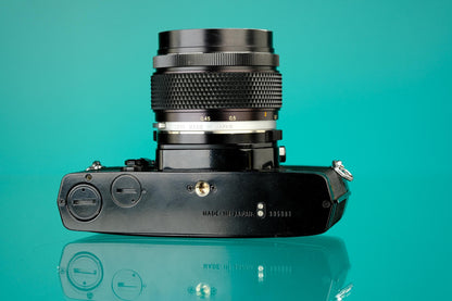 Olympus OM-1 Black 35mm SLR + 55mm f/1.2 Lens