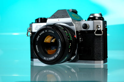 Canon AE-1 Program 35mm SLR Film Camera + 50mm f/1.8 nFD Lens