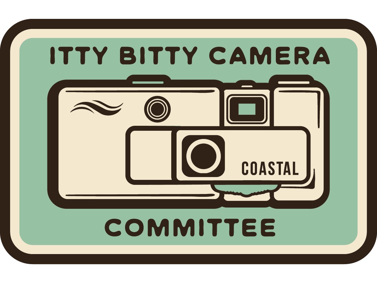 Itty Bitty Camera Committee– Waterproof Vinyl Sticker (2” x 1”)