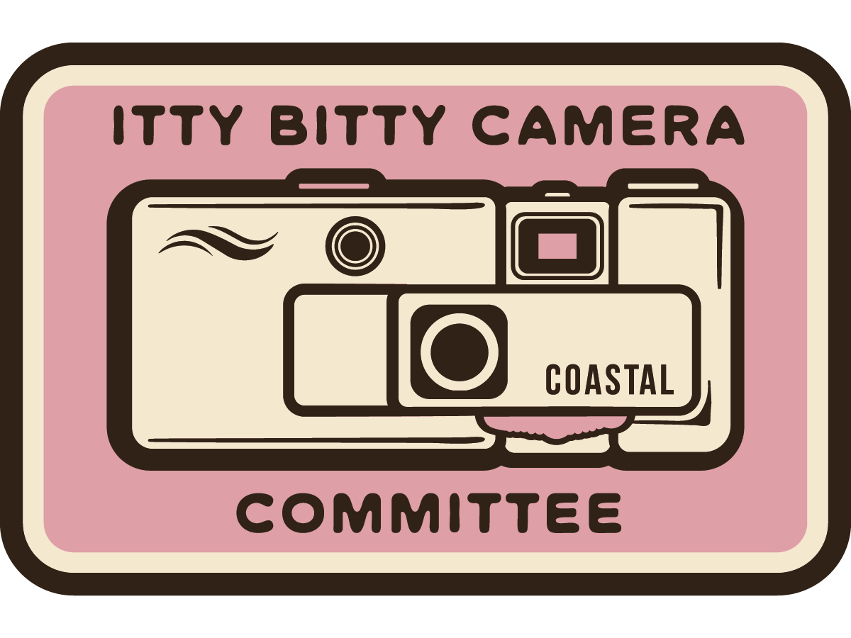 Itty Bitty Camera Committee– Waterproof Vinyl Sticker (2” x 1”)